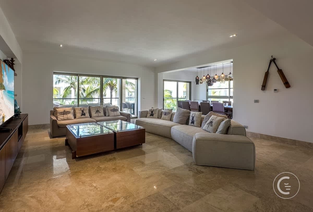 A spacious, modern living room with a large sectional sofa and coffee table.