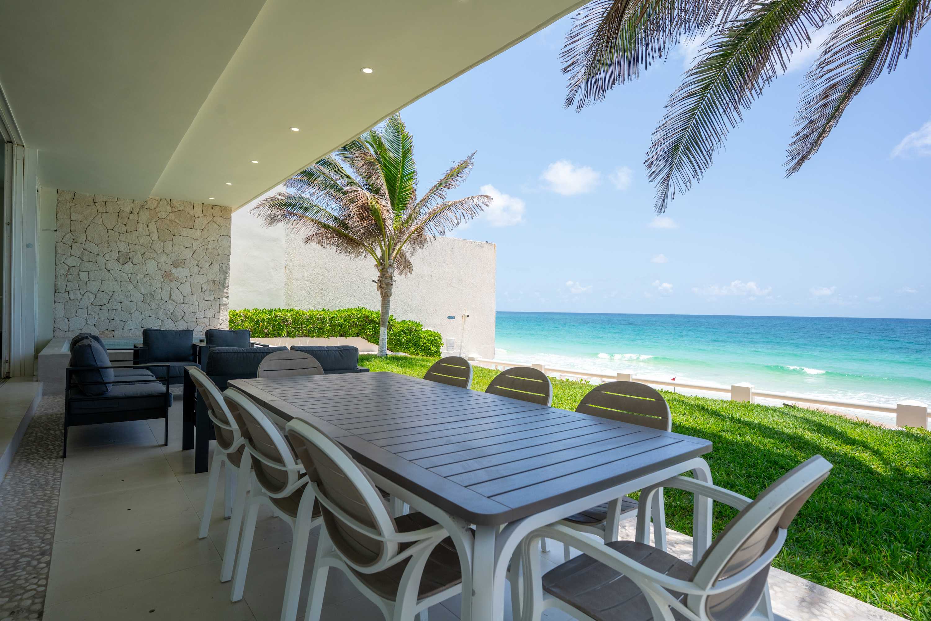 Outdoor dining set with ocean view.