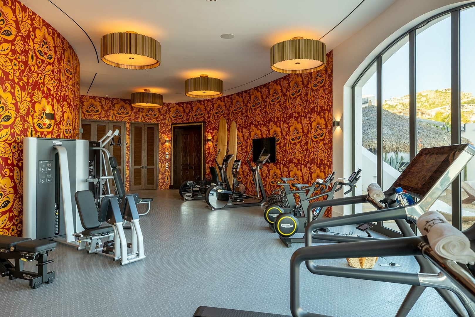 Another view of La Datcha's personal gym, showing the weight machines and treadmills.