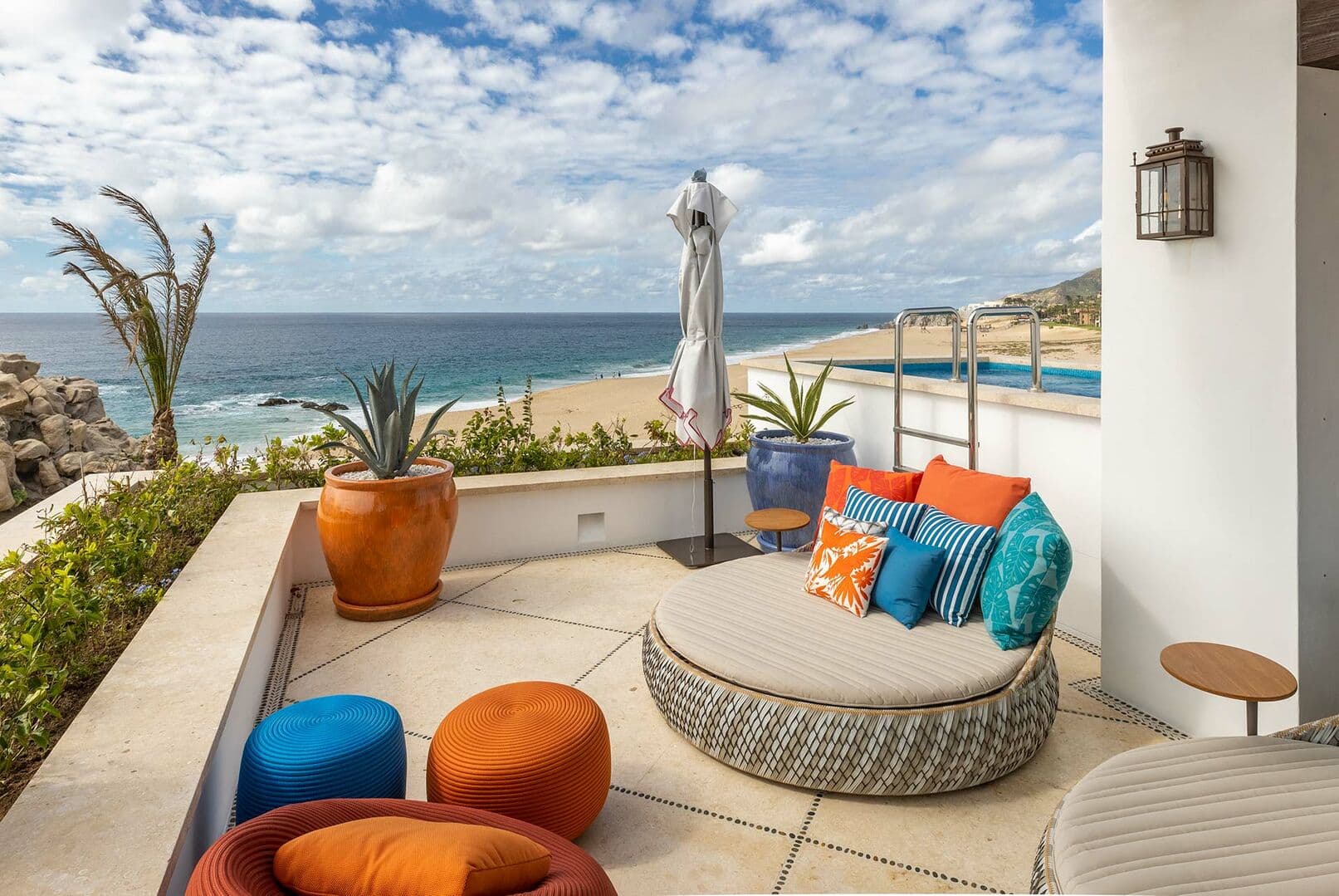 Views of the beach and ocean from one of the large chairs on a back patio.