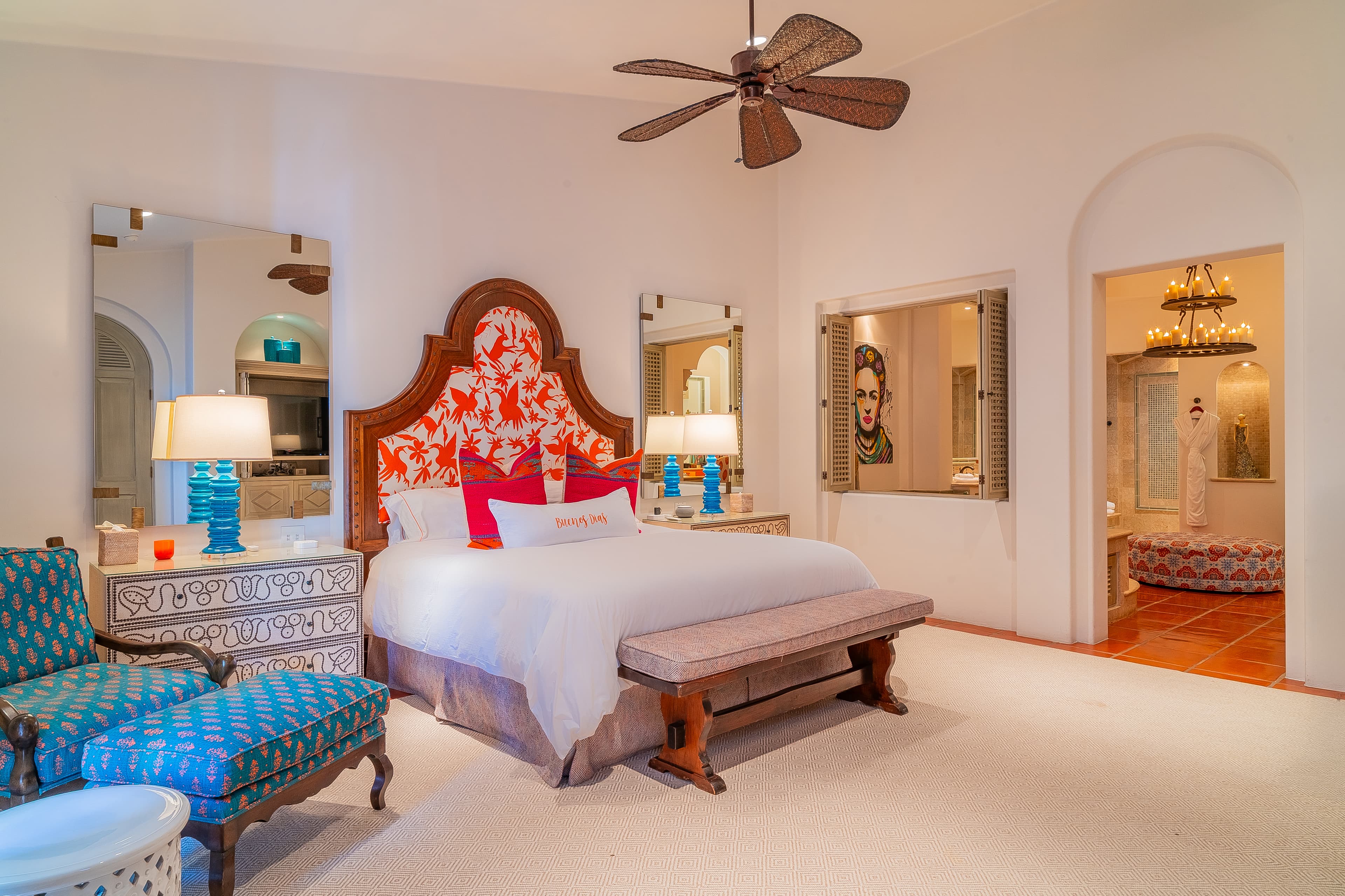 Bedroom 1 (Master) · Your spacious bedroom welcomes you with vibrant decor, a luxurious king bed, and charming archway views into cozy adjacent spaces—perfect for unwinding in style.