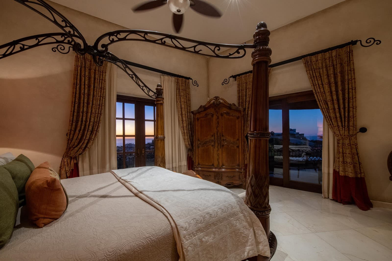 Bedroom 4 · A bedroom with two balcony doors and views of the ocean.