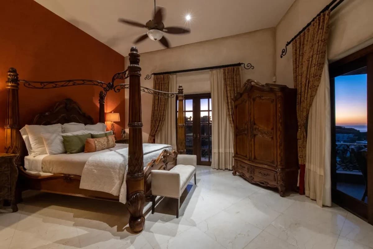 Bedroom 3 · Unwind in your private sanctuary featuring a romantic four-poster bed, elegant carved furnishings, and soothing warm tones that create the perfect ambiance for restful nights and peaceful mornings.