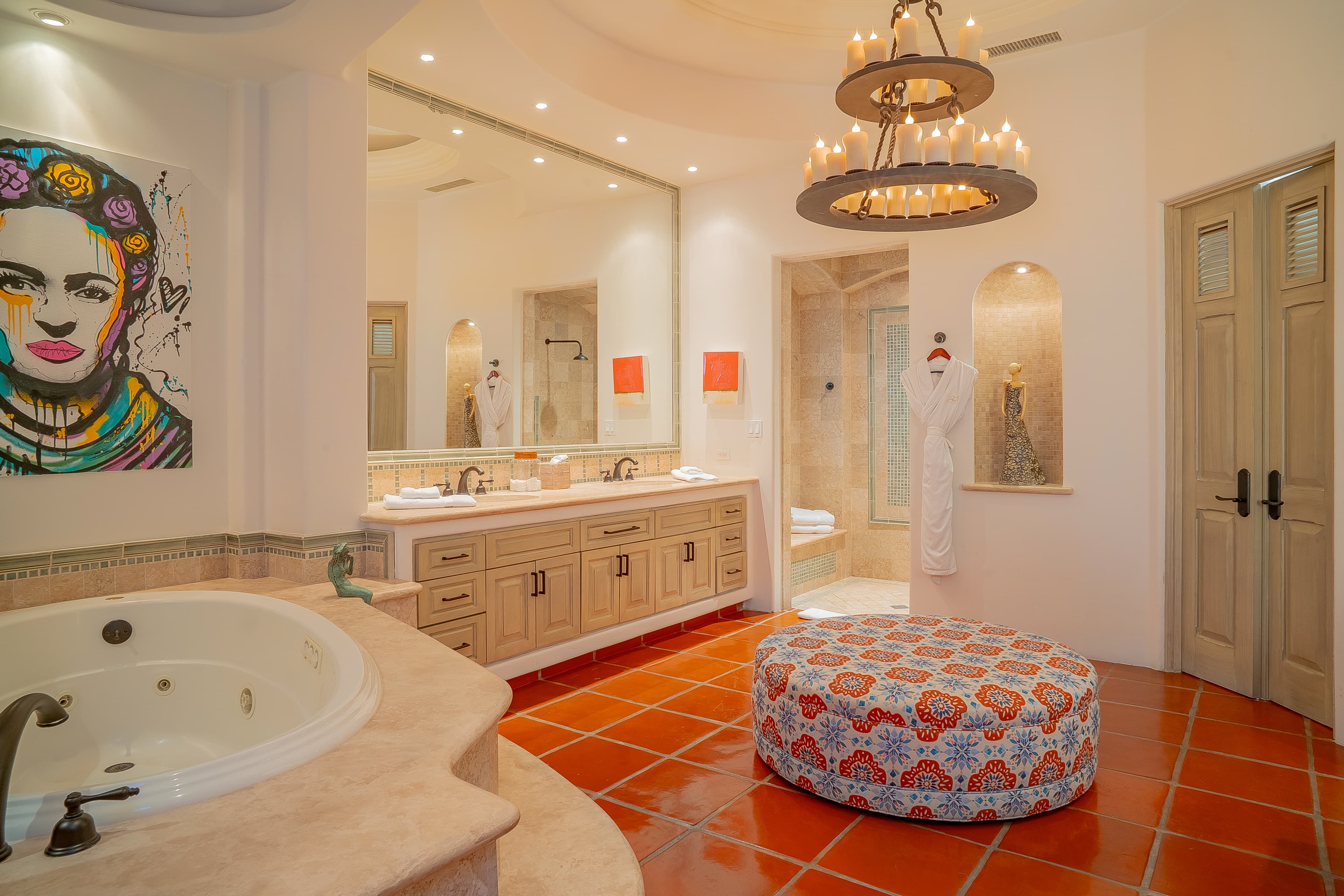 Bathroom 1 (Master ensuite) · Indulge in a spa-like retreat with vibrant artwork, a luxurious soaking tub, and twin vanities framed by warm lighting. Your private sanctuary awaits with thoughtful details and refined finishes throughout.