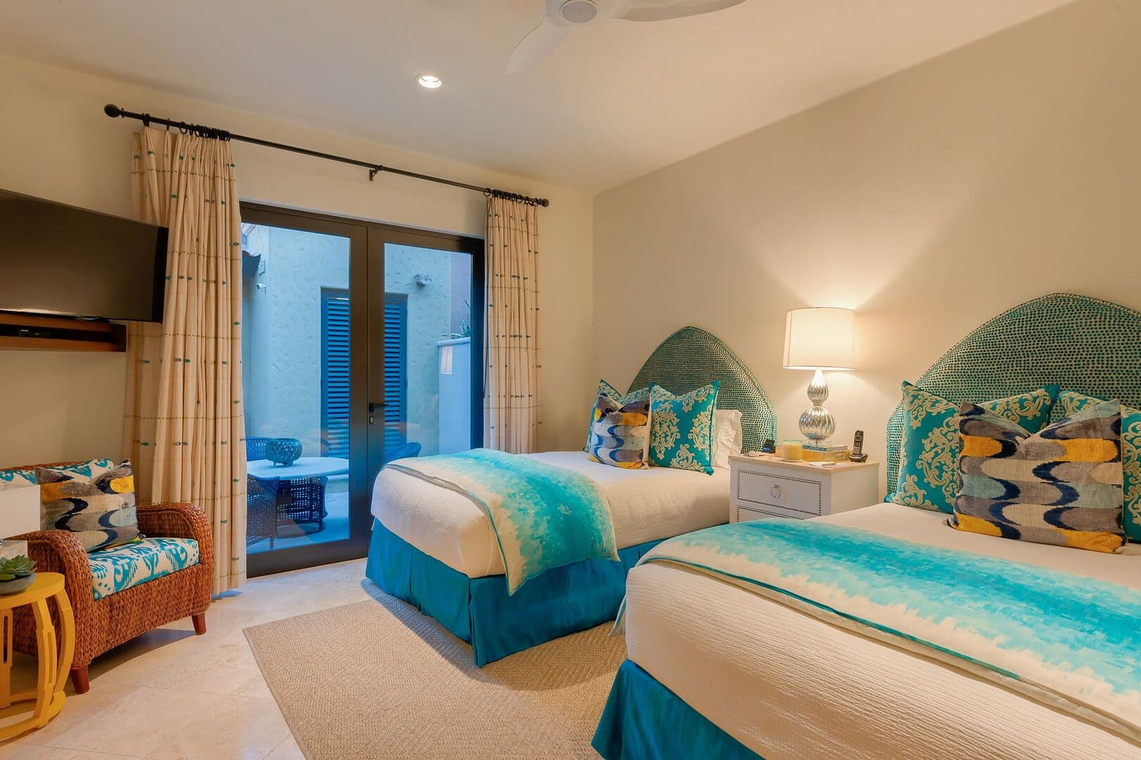 A 4th bedroom with 2 full sized beds and a outdoor sliding door to the patio.